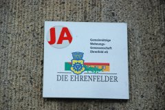 Wie umgehen mit „anrüchigen“ Straßennamen? - Köln Ehrenfeld, Logo der Wohnungsgenossenschaft an der Iltisstr.